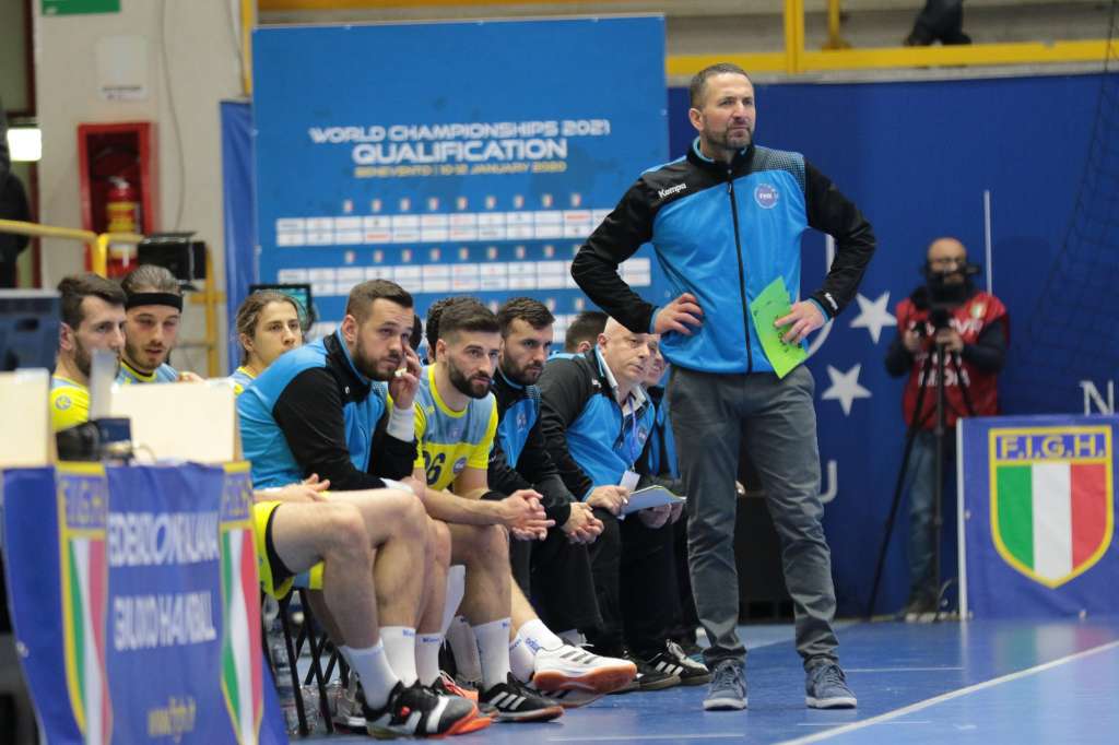 Taip Ramadani standing watches on during a game between Kosovo and ITaly